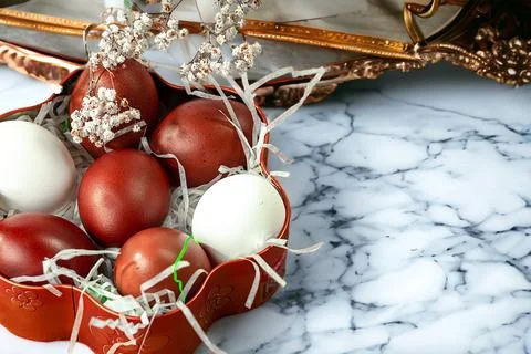 Easter background with Easter eggs and spring flowers. Top view with copy s.. Stock Photos