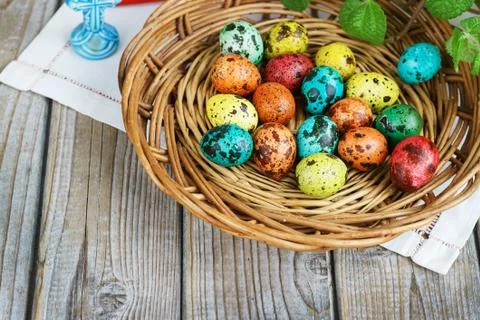 Easter background with Easter eggs in the basket and spring flowers Stock Photos