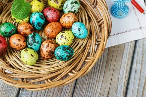 Easter background with Easter eggs in the basket and spring flowers Stock Photos