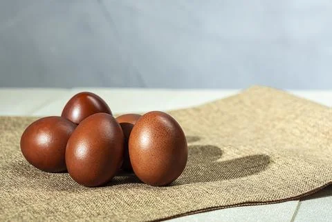 Easter background with Easter eggs on the table. Easter. Stock Photos