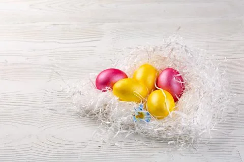 Easter background with Easter eggs. Top view with copy space. Stock Photos