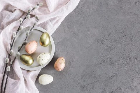 Easter background with eggs and spring willow branches.  Pastel colors. Flat Stock Photos