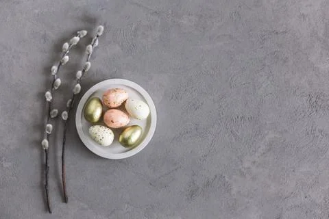 Easter background with eggs and spring willow branches.  Pastel colors. Flat Stock Photos