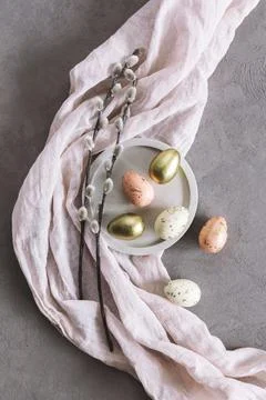 Easter background with eggs and spring willow branches.  Pastel colors. Flat Stock Photos