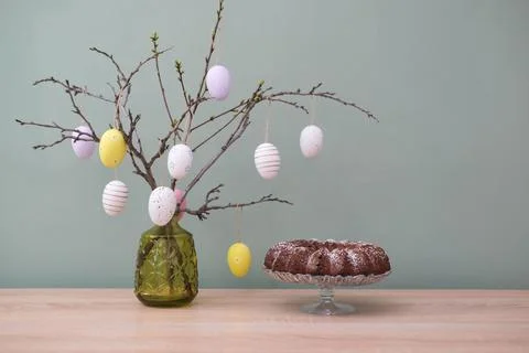 Easter background with eggs and spring branches. Happy Easter. Table settin.. Stock Photos