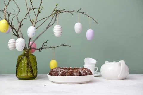 Easter background with eggs and spring branches. Happy Easter. Table setting  Stock Photos