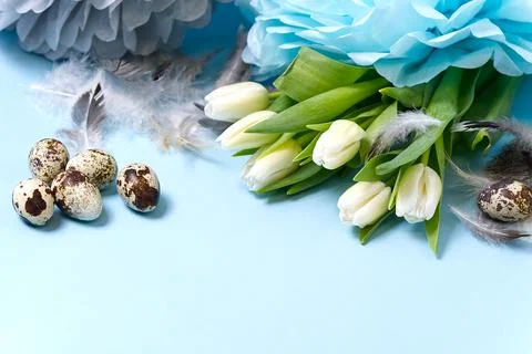 Easter background with eggs and white tulips. Stock Photos