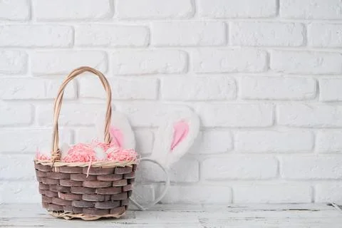 Easter background with eggs in basket and bunny ears 스톡 사진