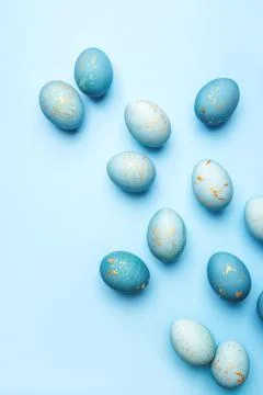 Easter background of eggs painted in blue color. Stock Photos