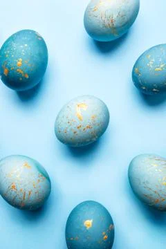 Easter background of eggs painted in blue color. Stock Photos