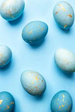 Easter background of eggs painted in blue color. Stock Photos