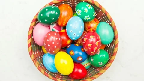 Easter background with handmade colored eggs on nest. Top view. Festive tra.. Stock Footage 234778740
