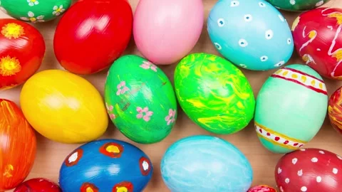 Easter background with handmade colored eggs. Top view. Festive tradition Stock Footage 235477532