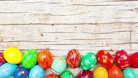 Easter background with handmade colored eggs. Top view and copy space. Fest.. Stock Footage 235937945