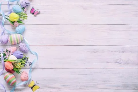 Easter background, on a light tree spring flowers, Easter eggs and ribbons Stock Photos