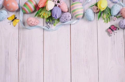 Easter background, on a light tree spring flowers, Easter eggs and ribbons Stock Photos
