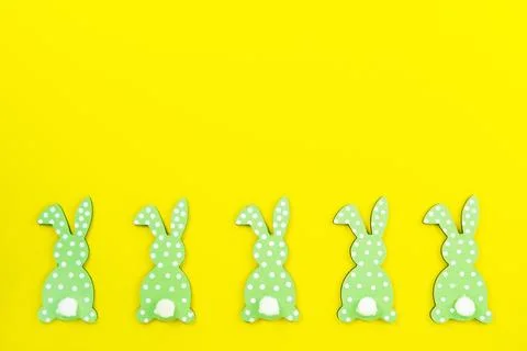 Easter background made of colored bunny, rabbits, hares from the backcn a yellow Stock Photos