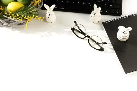 Easter background. office table desk, workspace with laptop, easter bunny,  bouq Stock Photos