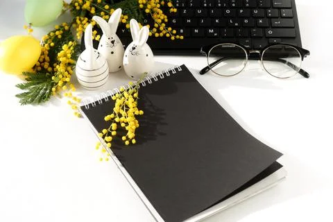 Easter background. office table desk, workspace with laptop, easter bunny,  bouq Stock Photos