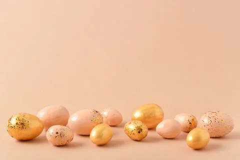 Easter background with painted eggs and sequins. Stock Photos