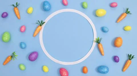Easter background pattern with colorful eggs and circle frame on pastel blue  Stock Photos