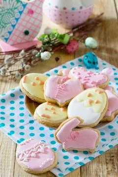 Easter background. Plate with delicious Easter cookies on a festive table. Stock Photos