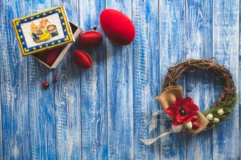 Easter background with red eggs, decorative wreath Stock Photos