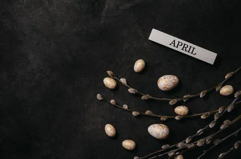 Easter background with willow,eggs and april inscription. copy space banner Stock Photos
