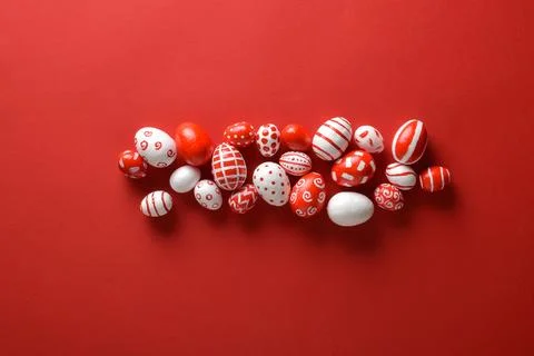 Easter backgrounds. Easter red and white eggs on bright red in the center o.. Photos
