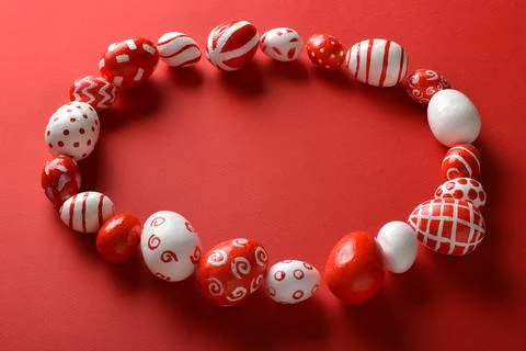 Easter backgrounds with a frame of Easter red and white eggs on a bright re.. Stock Photos