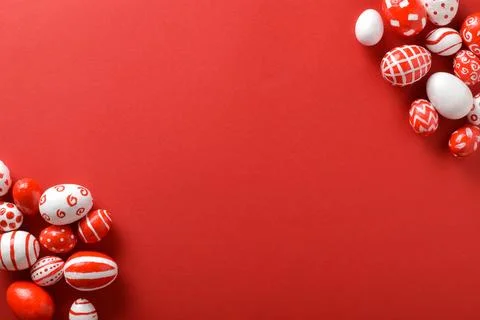 Easter backgrounds, scattered Easter red and white eggs on a bright red bac.. Stock Photos