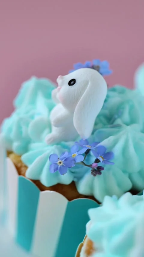Easter baking with flowers and sugar decorations in pastel colors.Vertical video Stock Footage 297493530
