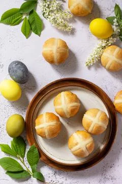 Easter baking. Homemade Easter traditional hot cross buns on a gray stone tab Stock-Fotos