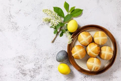 Easter baking. Homemade Easter traditional hot cross buns on a gray stone tab Stock-Fotos