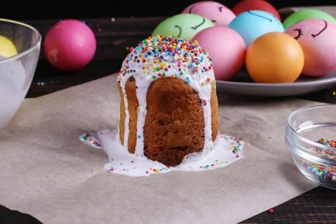 Easter baking with icing and colored powder and eggs. Preparing for the holid Stock Photos