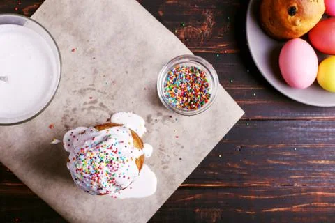 Easter baking with icing and colored powder and eggs. Preparing for the holid Stock Photos