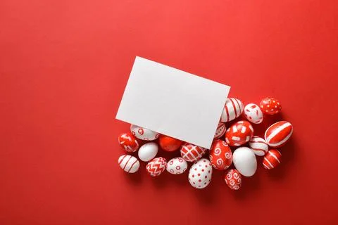 Easter banner with a blank sheet of paper and Easter red and white eggs on .. Stock Photos