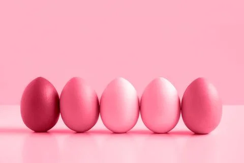Easter banner with colorful Easter Egg in a row on white table and viva magen Stock Photos