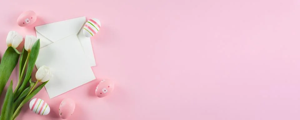 Easter Banner. Easter eggs, empty card blank and spring tulips. Mockup concep Stock Photos