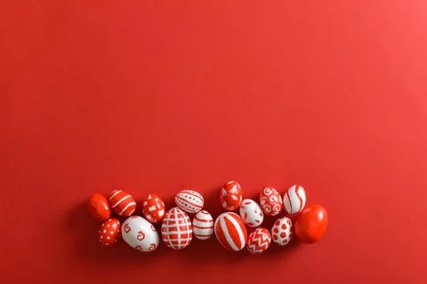 Easter banner with Easter red and white eggs on a bright red background. Spac Stock Photos