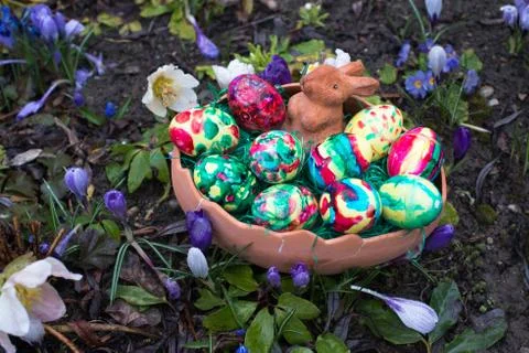 Easter basket amongst spring crocus flowers Stock Photos