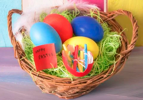 Easter basket and eggshell with rolled messages Stock Photos