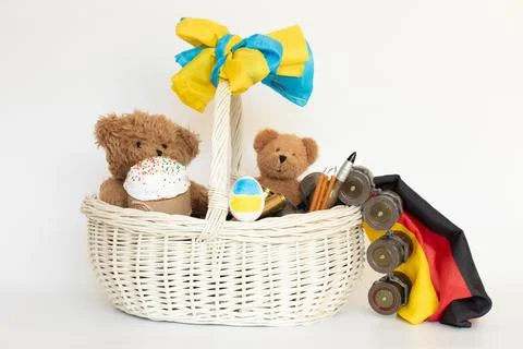 Easter basket with bears and flags of Germany and Ukraine and bullets and g.. Stock Photos