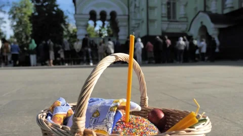 Easter basket with cake and eggs on Easter blessing background Stock Footage 274842925