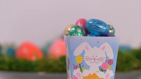 Easter Basket of Chocolate Mini Eggs Rotating, Easter Video stock 129066777