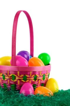 Easter basket with colored eggs Stock Photos