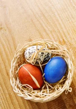 Easter basket with colored eggs. Stock Photos