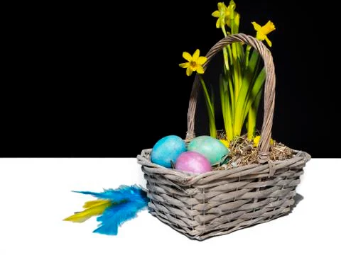 A easter basket with colored eggs Stock Photos
