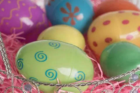 Easter basket with colorful easter eggs Stock Photos