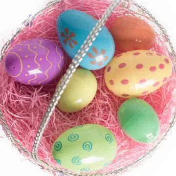 Easter Basket with Colorful Easter Eggs Stock Photos